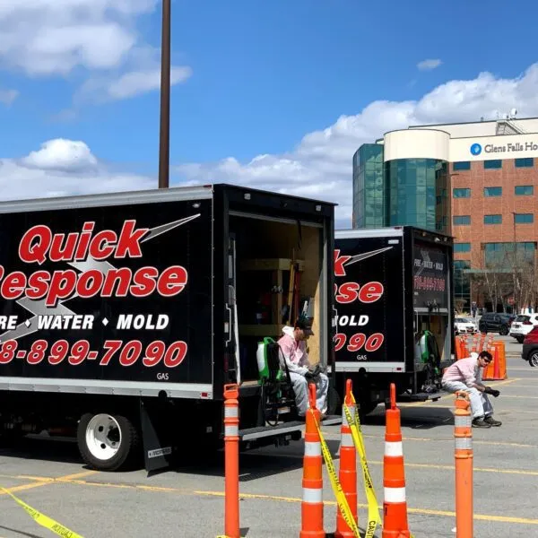 Quick Response Restoration trucks parked outside Glens Falls Hospital during service work